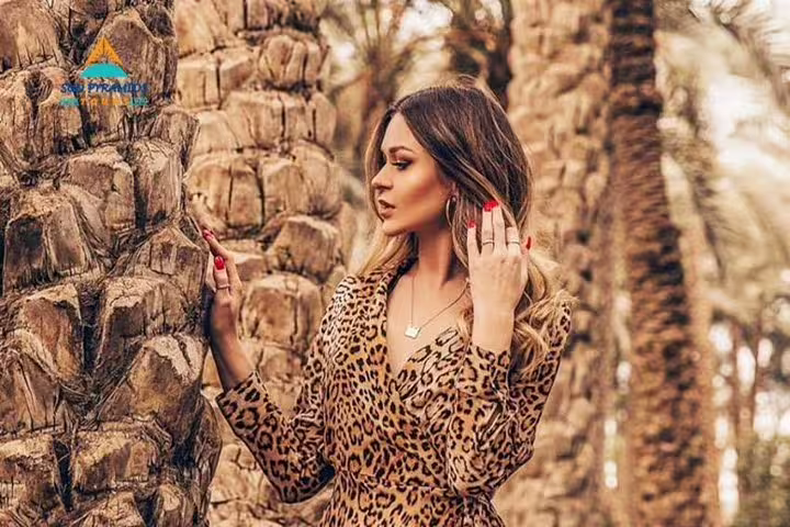 Traveler in a palm grove at Green Farm Egypt, enjoying a serene countryside breakfast tour experience