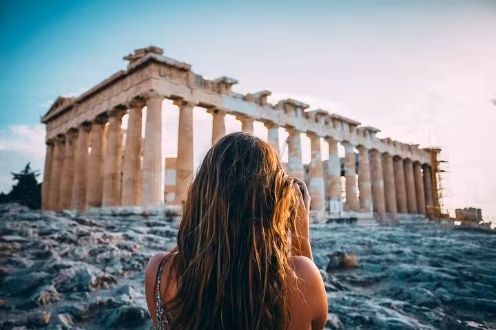 Traveler photographing the Parthenon on Acropolis Hill during a private full-day Athens city tour