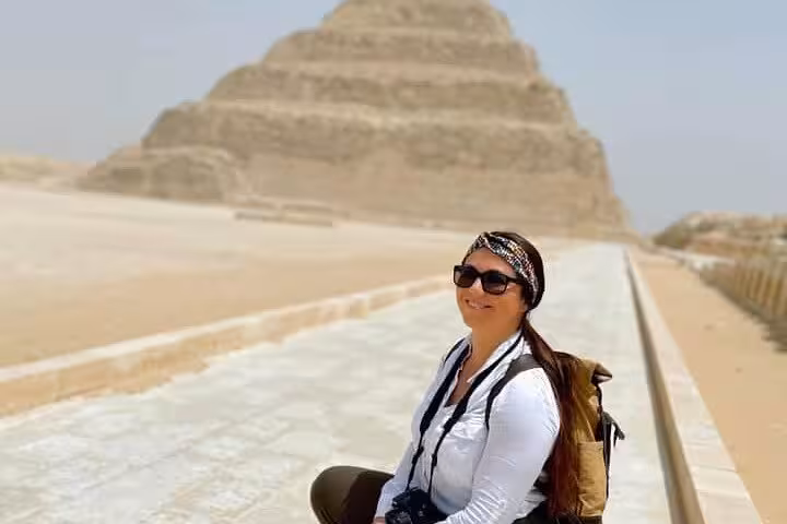 Traveler at Saqqara Step Pyramid on private Giza, Saqqara and Memphis tour with camel ride from Cairo