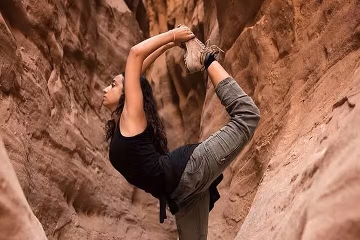 Traveler stretching in Salama Canyon, Sinai Desert, during Canyon Salama Jeep safari and Dahab day trip