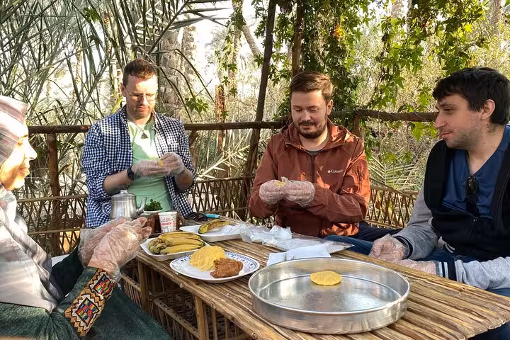 Travelers make traditional Egyptian bread with local hosts in Dahshur countryside farm day experience