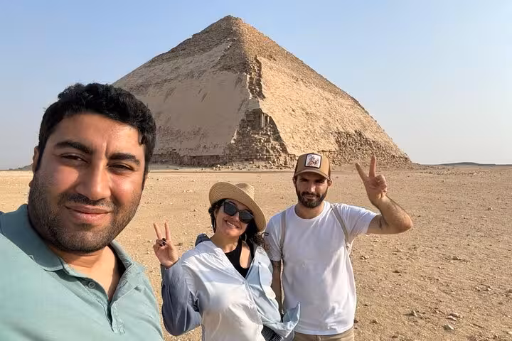 Travelers posing by the Red Pyramid at Dahshur on a private Saqqara, Memphis and Dahshur day tour