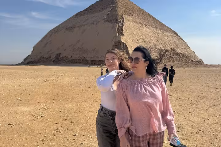 Travelers posing by the Red Pyramid in Dahshur on a private Saqqara Memphis and Dahshur day tour