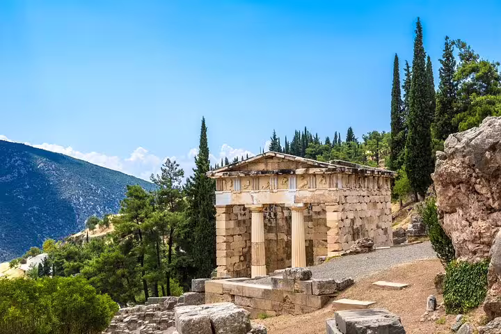 Treasury of the Athenians at Delphi, scenic stop on full-day private Oracle site and museum tour in Greece