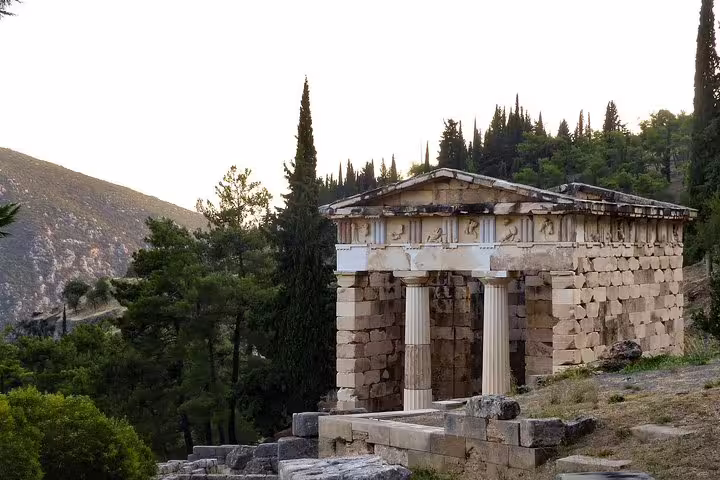 Treasury of the Athenians at Delphi ruins, scenic stop on private Delphi and Arachova day tour from Athens