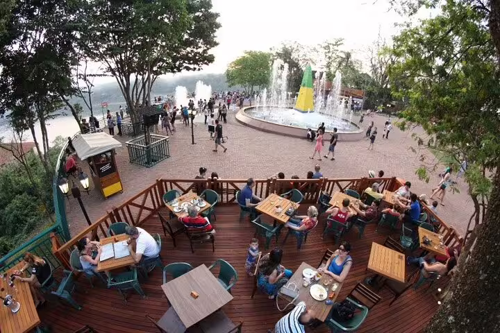 Aerial view of Tres Fronteiras Landmark showing vibrant outdoor dining and lively fountain area.