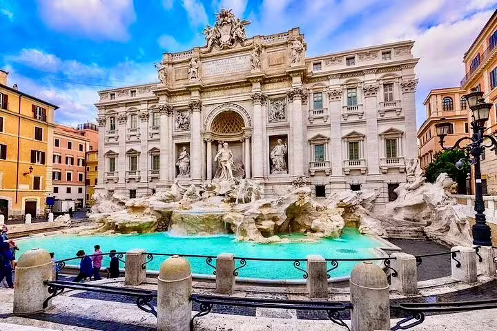 Trevi Fountain with turquoise water and baroque statues, iconic stop on a luxury chauffeured sightseeing tour of Rome