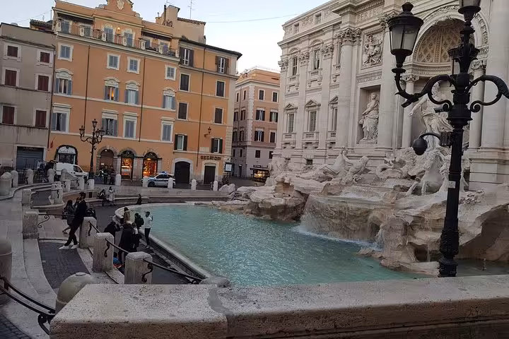 Trevi Fountain in Rome at dusk, baroque sculptures and turquoise water on 10-day Italy tour