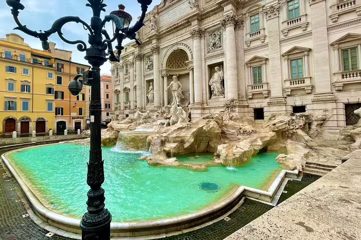 Trevi Fountain Rome with turquoise water and baroque statues on a family friendly private kids tour of hidden city highlights