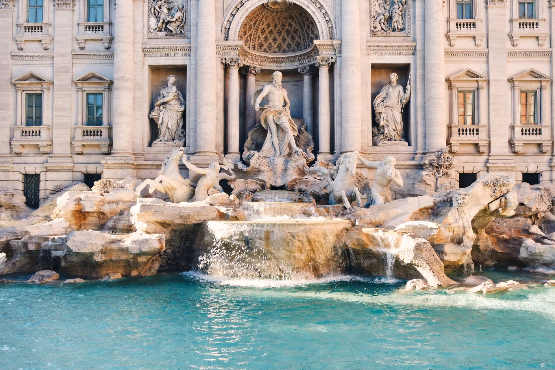 Majestic Trevi Fountain with intricate sculptures and flowing water, a highlight of the Squares and Fountains Combo Tour.