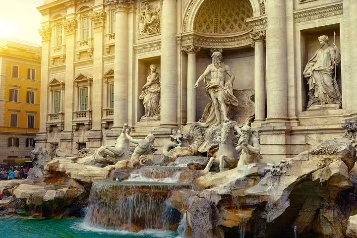 Trevi Fountain at sunset in Rome with baroque statues and turquoise water, a highlight of famous squares and fountains tour