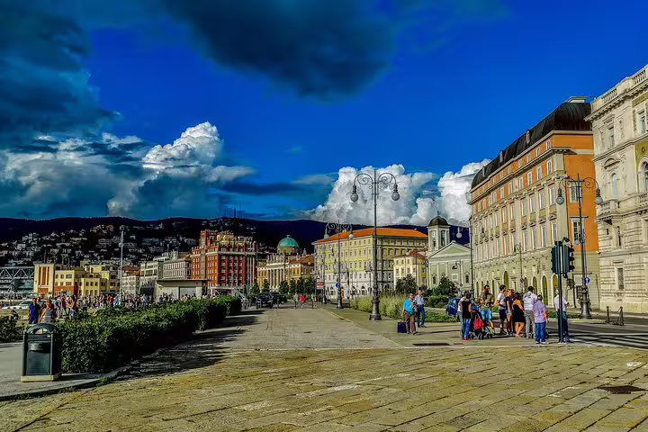 Colorful Habsburg-era waterfront buildings and lively promenade in Trieste, Italy, visited on a private walking tour