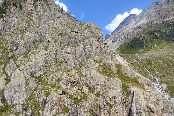 Rocky alpine trail above Gadmen on Zurich day trip hike toward Trift Suspension Bridge in the Swiss Alps