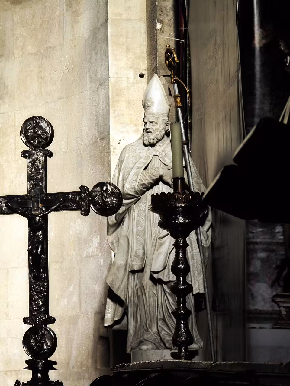 Stone bishop statue with cross inside Trogir Cathedral, part of the Discover Trogir Old Town tour experience