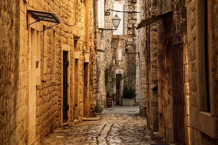 Narrow cobblestone lane in Trogir Old Town, Croatia, ideal stop on a private walking tour with local guide