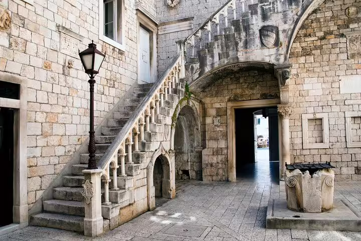 Stone courtyard and staircase in Trogir old town, a historic stop on the Blue Lagoon & 3 Islands speedboat tour