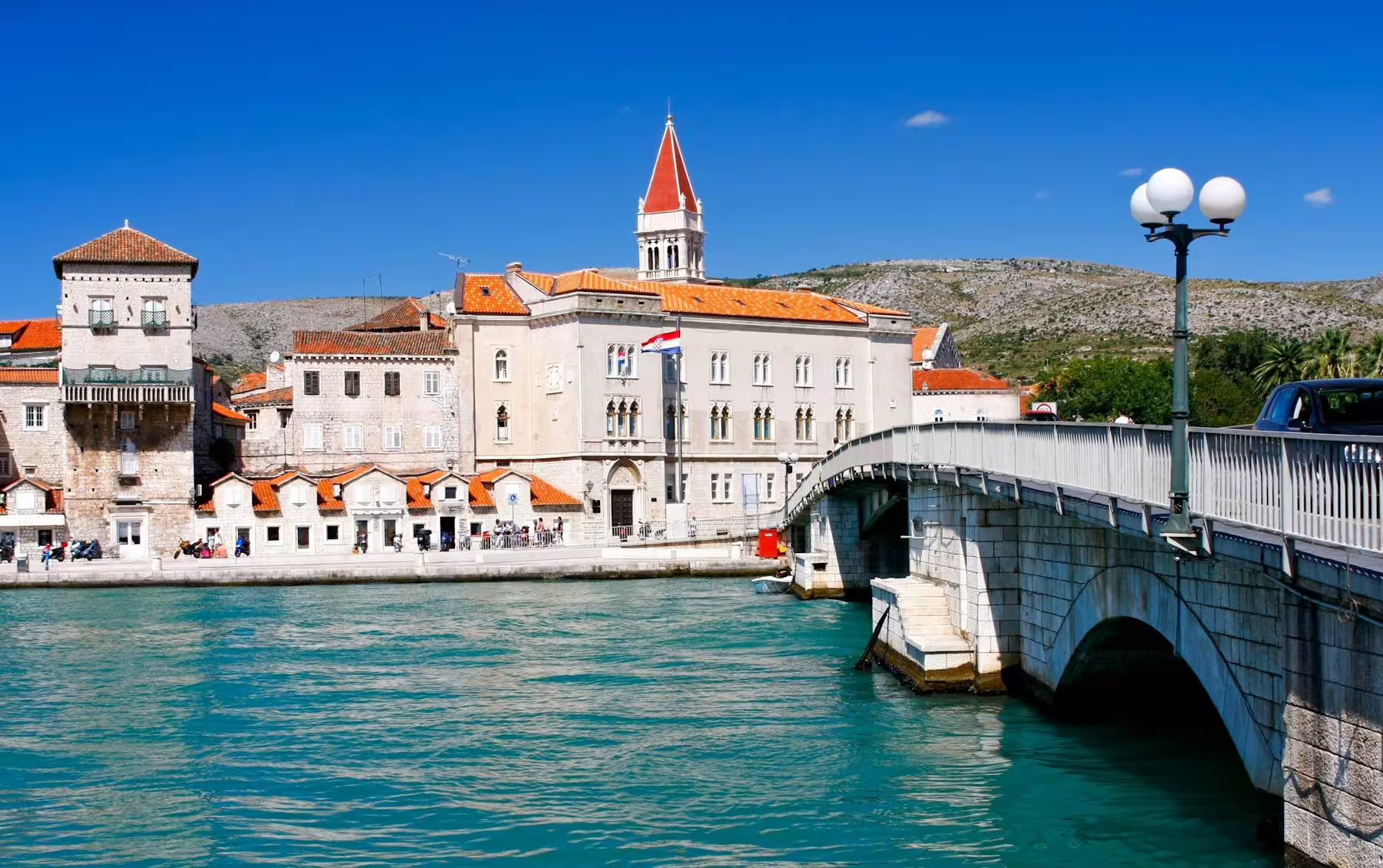Trogir old town waterfront and bridge with red-roof skyline, stop on Makarska Riviera day trip to Trogir and Split