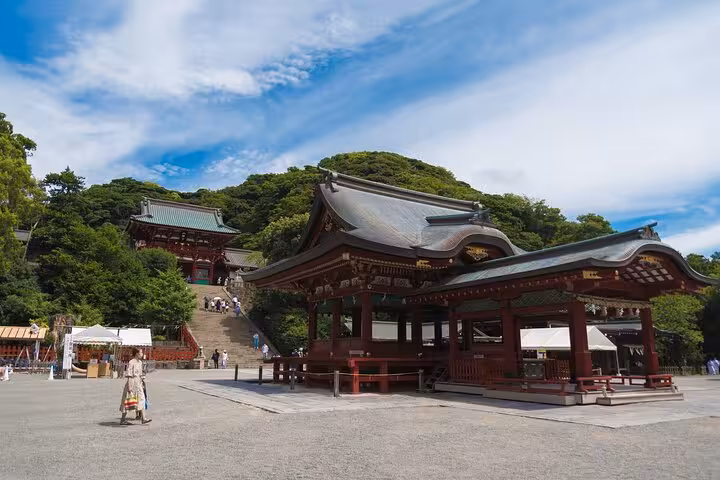 The historic Tsurugaoka Hachimangu Shrine under a blue sky in Kamakura, a key stop on the Tokyo to Kamakura private tour.
