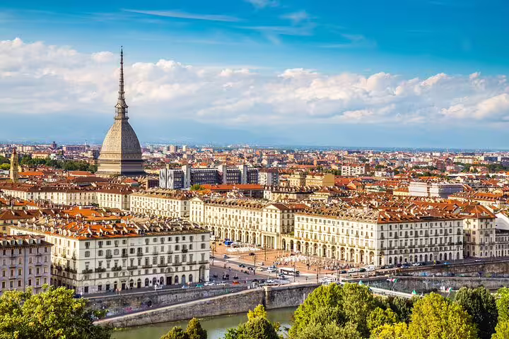 Panoramic view of Turin skyline with Mole Antonelliana and historic piazzas on a private guided walking tour in Italy