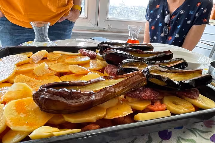 Tray of Turkish home-cooked eggplant and potatoes prepared during an authentic Istanbul cooking class