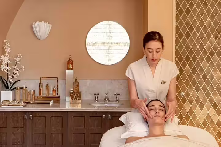 Therapist giving relaxing face massage in Hurghada Turkish hamam VIP package with full body massage