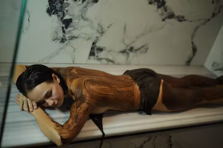 Body scrub with exfoliating mud at Turkish hammam spa in Sharm El Sheikh, full treatment package experience