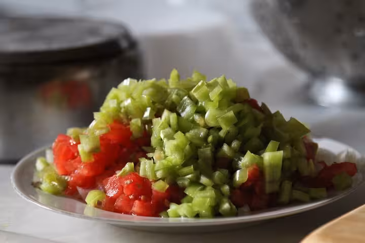Chopped tomatoes and green peppers prepped for Turkish meze cooking class for beginners in Istanbul