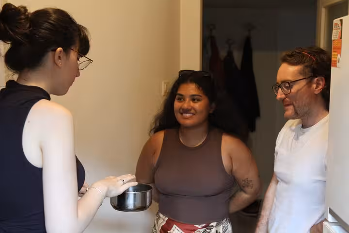 Guests listening to host in Istanbul kitchen during Turkish meze cooking for beginners hands-on workshop