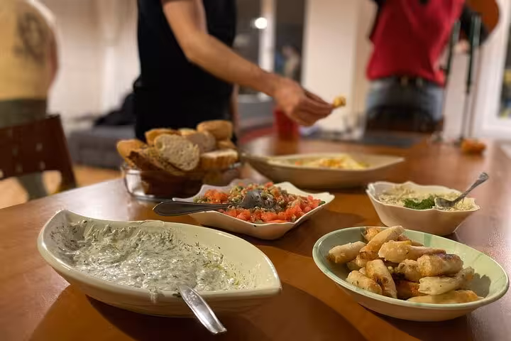 Homemade Turkish meze spread with bread and dips on table during beginner cooking class in Istanbul