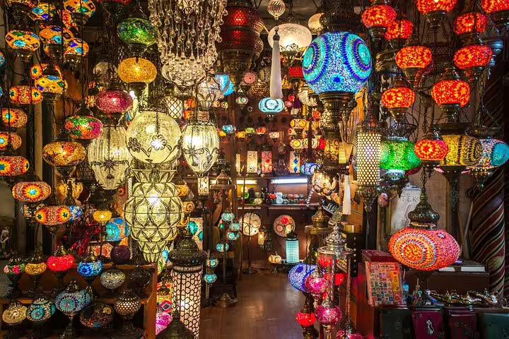 Colorful Turkish mosaic lamps at Istanbul Grand Bazaar shop, part of 8-day Turkey mini group tour by flights