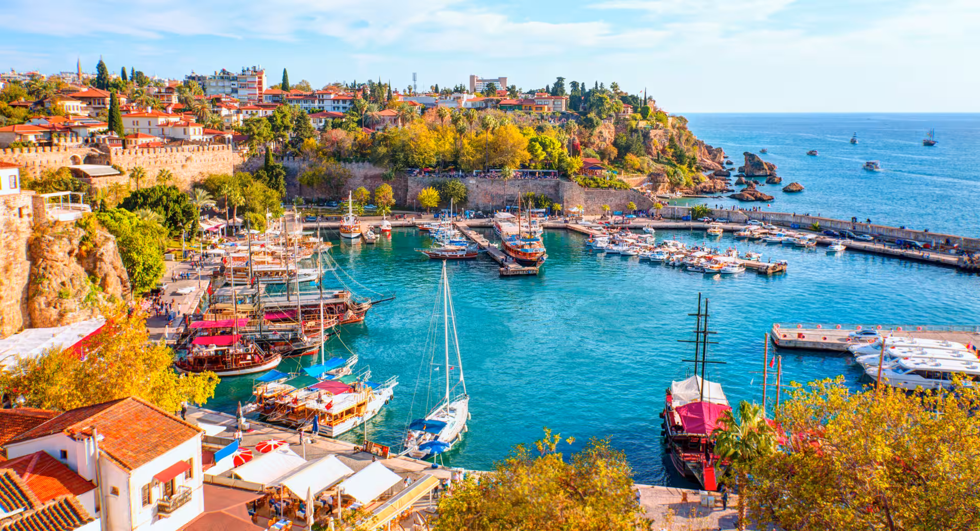 Colorful Turkish Riviera waterfront with boats and turquoise water