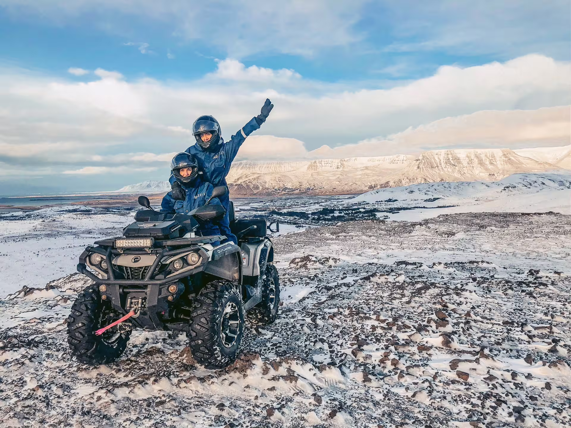 Adventurers enjoy a thrilling 2-hour ATV ride through snowy Twin Peaks, showcasing stunning panoramic mountain vistas.
