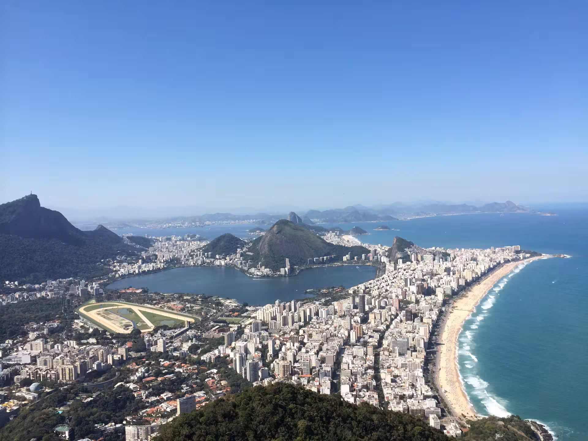 Stunning aerial view of Rio de Janeiro's coastline from Two Brothers Hill, highlighting the vibrant cityscape.