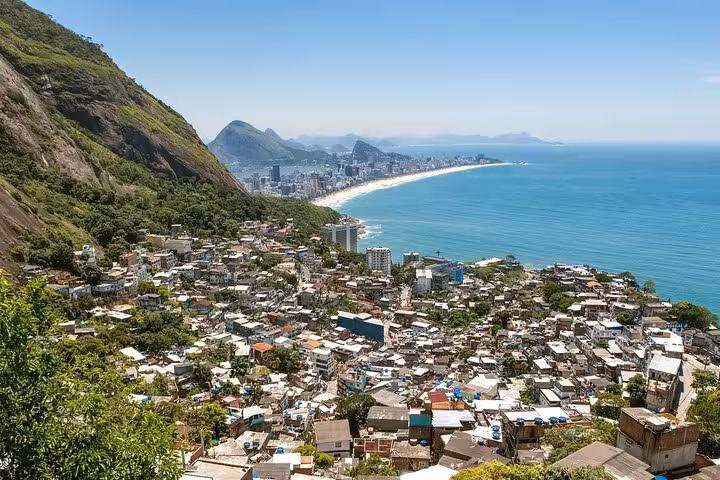 Scenic view from Two Brothers Hill overlooking Vidigal Favela and Rio's coastline, perfect for a hiking tour.
