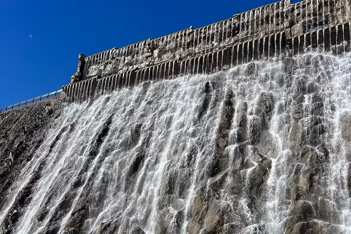 Water cascading over a dam in UAE, scenic stop on Emirates history, culture and attractions tour