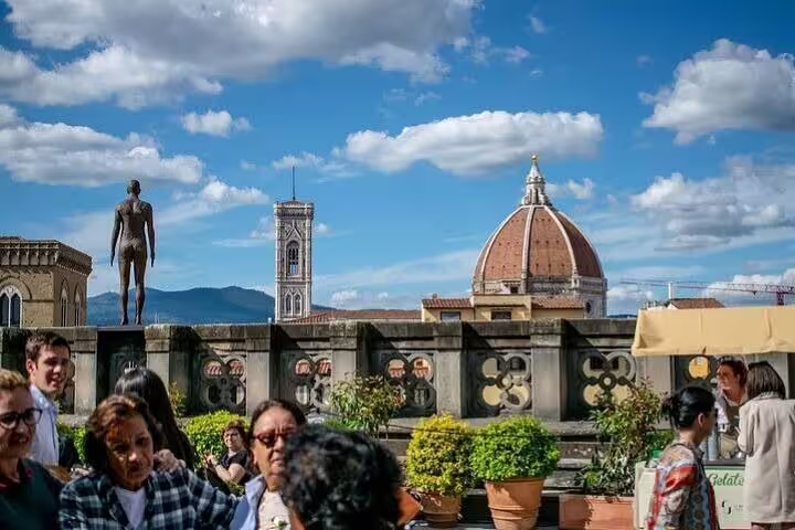 Visitors on the Uffizi terrace enjoy panoramic views of Florence Duomo and Giotto’s bell tower on a guided combo tour