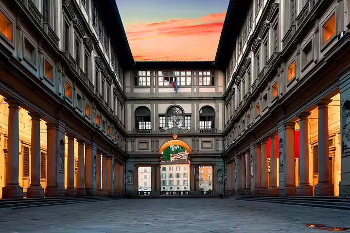 Sunset over the Uffizi Gallery courtyard in Florence, meeting spot for small group tours with expert local guides