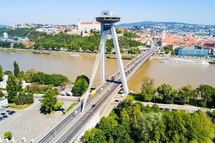 UFO Bridge over the Danube in Bratislava skyline, seen on a private tour from Vienna with Devin Castle