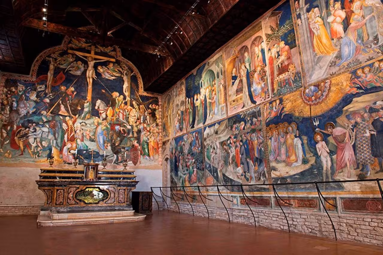 Vivid Renaissance frescoes inside an Urbino church, immersive art and history stop on the guided flavors journey