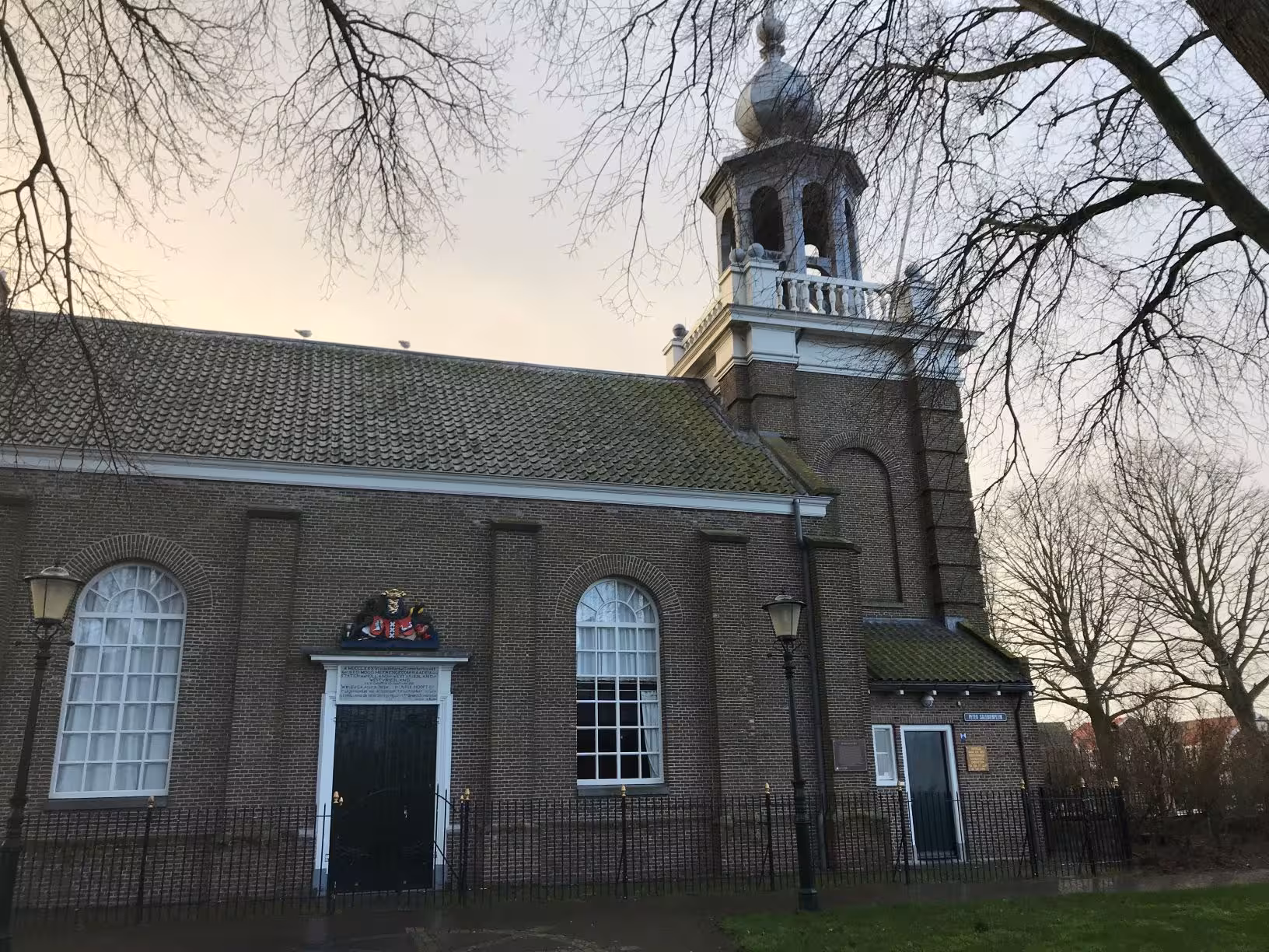 Historic brick church and bell tower in Urk, photo stop on private tour from Amsterdam to Dutch landmarks