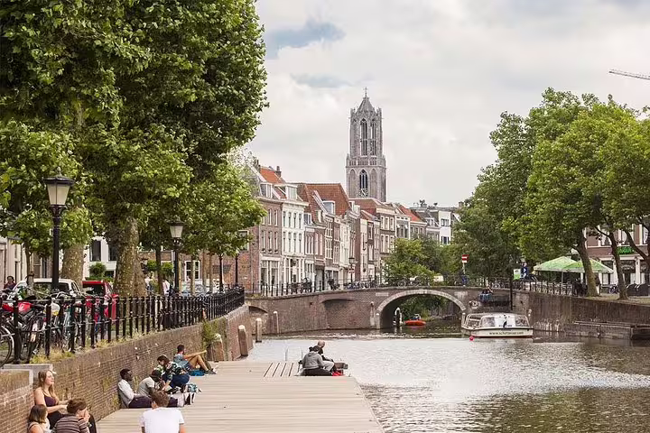 Utrecht canal with bridge and Dom Tower view, ideal for a self-guided e-scavenger hunt city walk