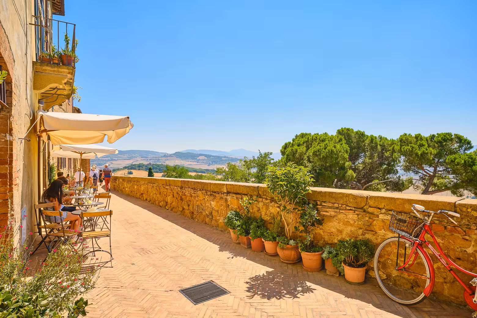 Enjoy scenic views and outdoor dining in Pienza during the Val d'Orcia private tour from Florence.