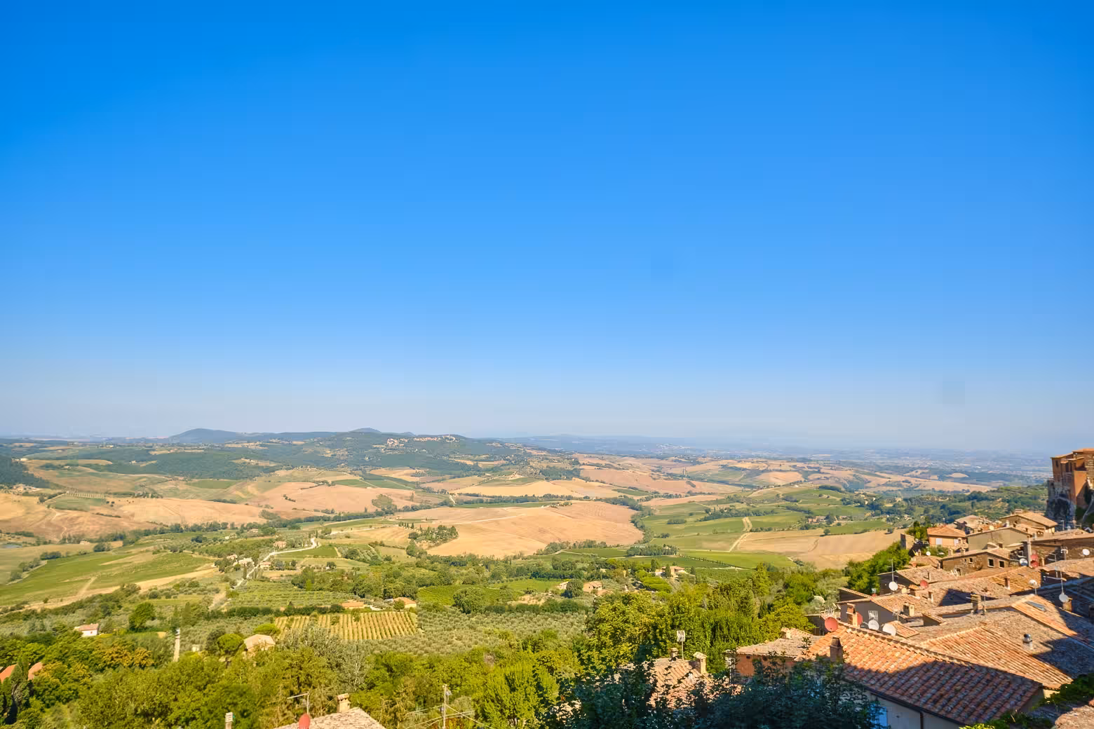 Marvel at the sweeping vistas of Val d'Orcia's rolling hills and vineyards from a Montepulciano viewpoint.