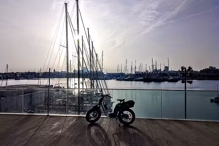 E-bike parked by Valencia Marina at sunset, ideal start for e-bike tour before Mediterranean catamaran cruise