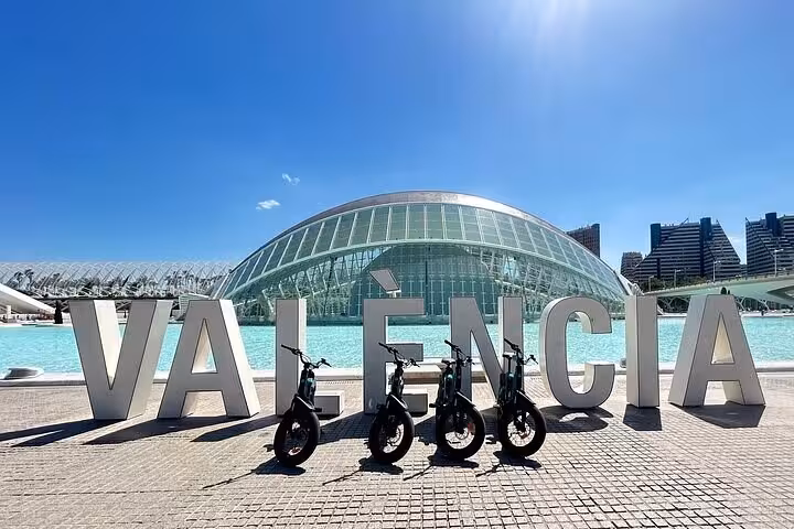 E-bikes at Valencia sign by City of Arts and Sciences, start of Valencia e-bike tour and catamaran cruise