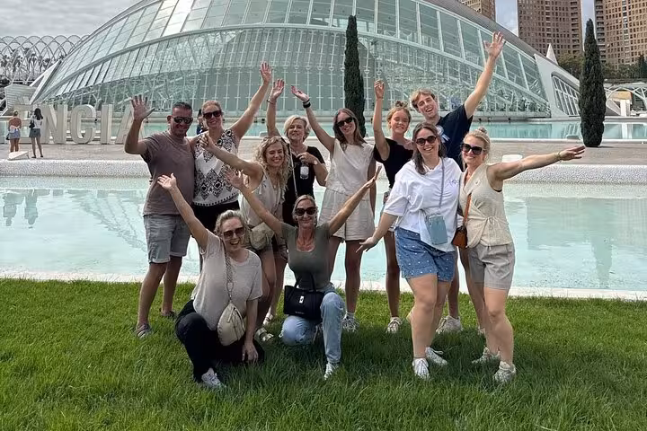 Group photo at Valencia City of Arts and Sciences on guided e-bike tour, combining old town sights and beaches