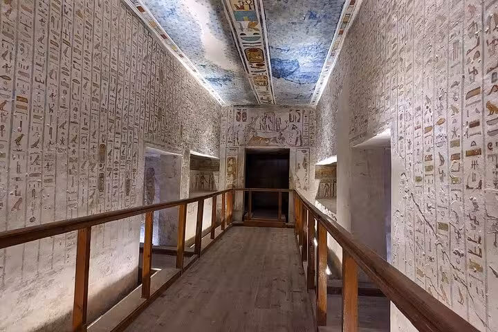 Intricately decorated corridor inside a tomb in the Valley of the Kings, Luxor, showcasing ancient Egyptian art.