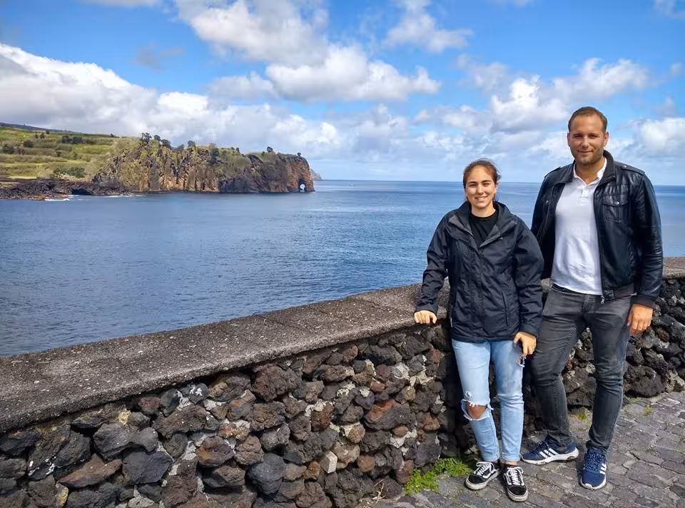 Travelers enjoying coastal views of São Miguel Island on a full-day van tour near Sete Cidades and Lagoa do Fogo
