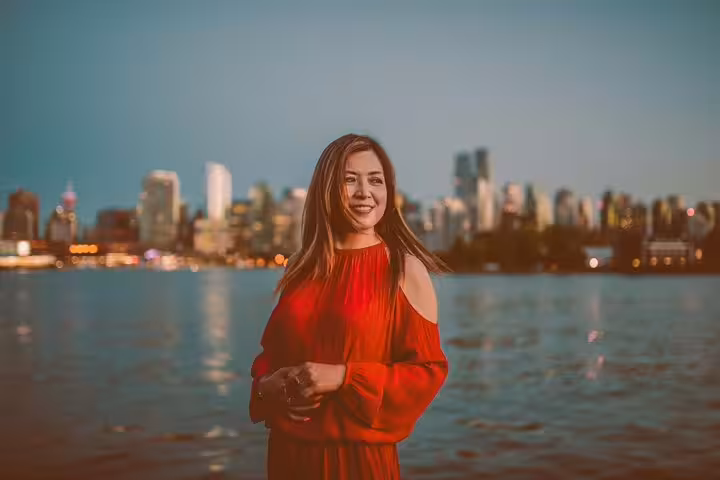 Twilight portrait with Vancouver skyline across the water, private travel photographer tour for stunning photos