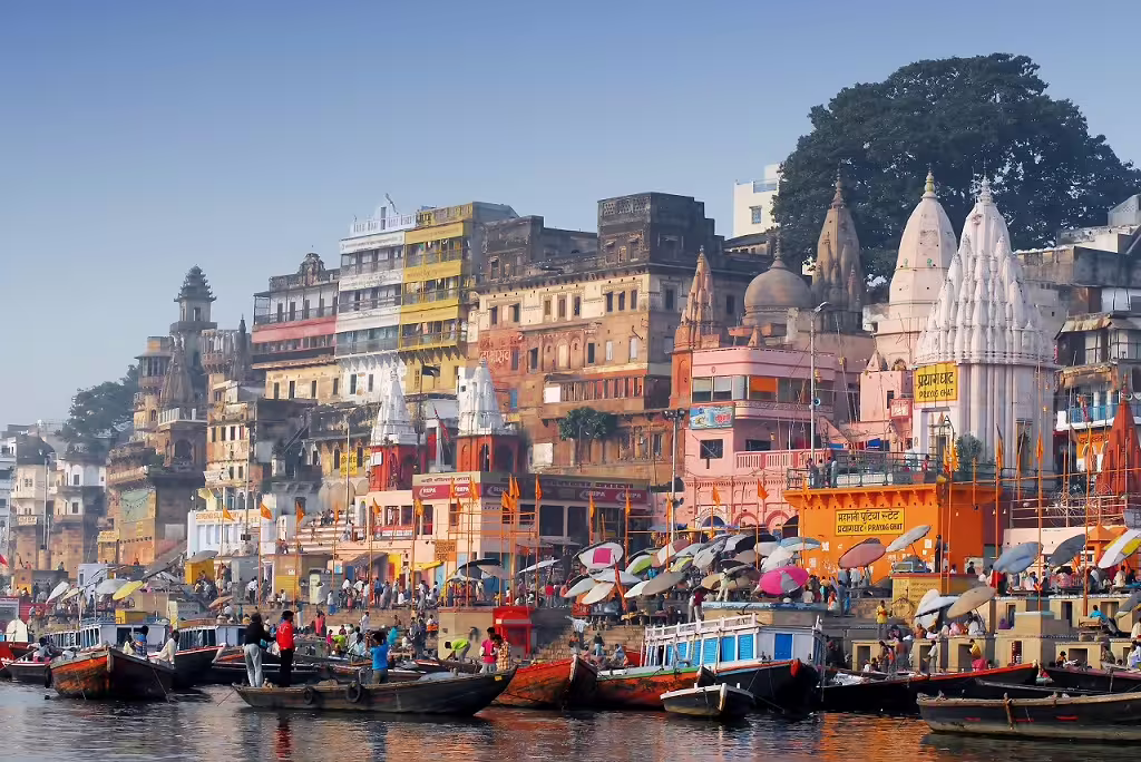 Experience the vibrant ghats of Varanasi bustling with life along the sacred Ganges River in North India.
